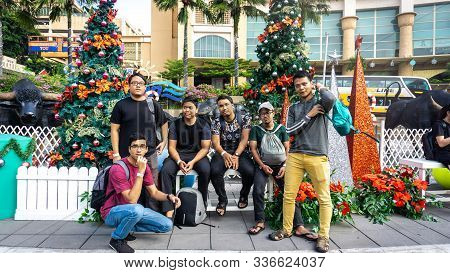 Subang Jaya, Malaysia - November 28, 2019: Group Of Friends Taking Photo At The Entrance To The Sunw