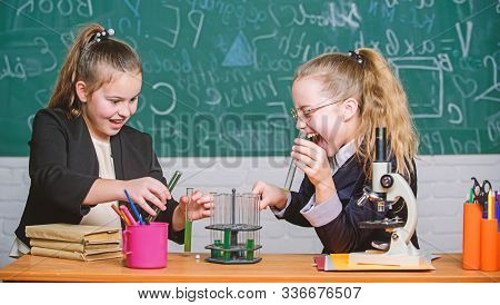 Educational Experiment Concept. Microscope And Test Tubes On Table. Be Careful Performing Chemical R
