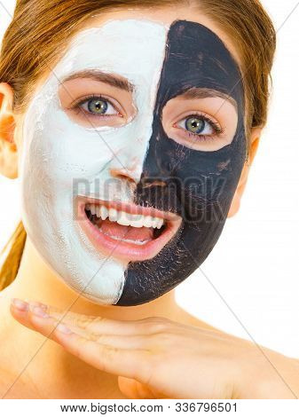 Girl With Black White Mud Mask On Face