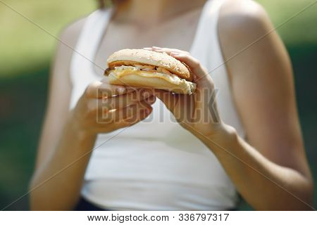 Cute And Stylish Girl With A Humburger