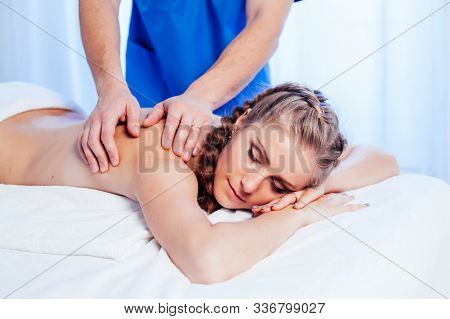 Girl Masseur Doing Massage Back Spa Health
