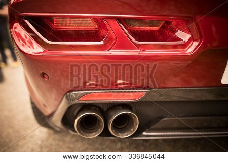 Close Up Horizontal Image Of The Led Tail Lights And Exhaust Pipes Of A New Sport Super Car.