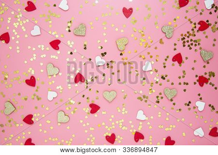 Table Top View Valentine's Day Pink Background. Flat Lay Arrangement Of Hearts And Golden Glitter. V