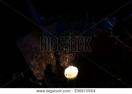 Dirty Old Shovel In Dark Trench. Digging Grave By Candlelight. Mystical Night Scene