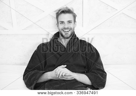 Guy In Bathrobe Relaxing. Relaxing Before Fall Asleep. Get Enough Amount Of Sleep Every Night. Maint