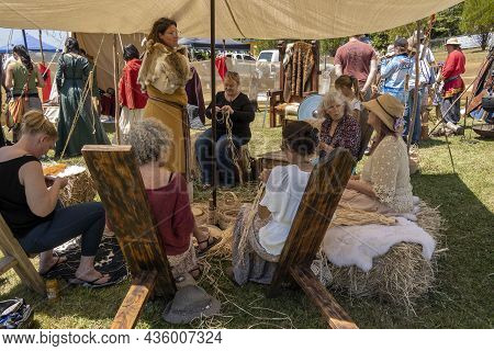 Eungella, Queensland, Australia - October 2021: A Viking Village Re-enactment Fair With Women Sittin