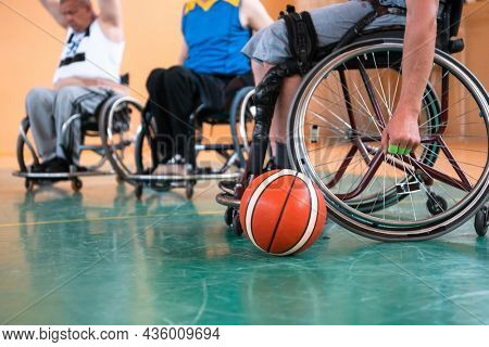 a photo of basketball teams with disabilities with the selector in the big hall before the start of the basketball game