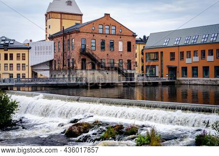 Norrkoping, Sweden - July 27, 2021: Beautiful Cityscape With Old Industrial Buildings And Water Rese