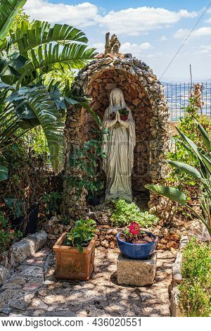 Haifa, Israel. June 17, 2021: The Statue Of Virgin Mary In The Garden Of Muhraka Monastery Of The Ca
