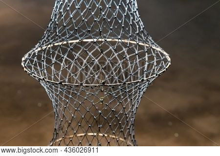 Fish Trap Hanging Vertically Close-up On A Blurred Background