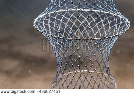 Wicker Fish Trap Network, Storage Tank Catch Close-up Vertical