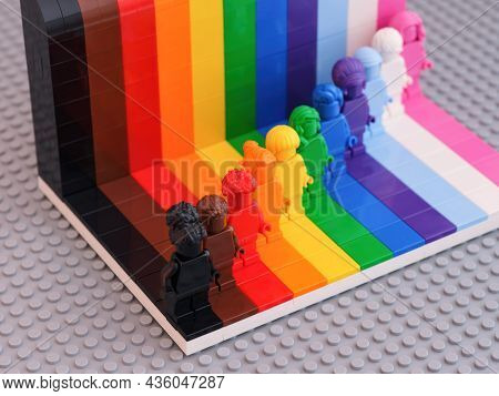 Tambov, Russian Federation - August 12, 2021 Eleven Lego Monochrome Minifigures Against A Rainbow Ba