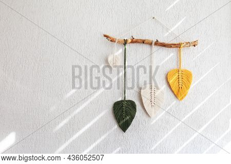 Macrame Leaves Wall Hanging In Yellow, White And Green  And Natural Color On The Wooden Stick. Cotto