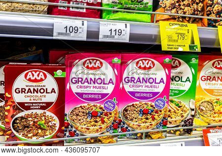 Samara, Russia - October 10, 2021: Axa Premium Granola Crispy Muesli In Assortment On The Store Shel