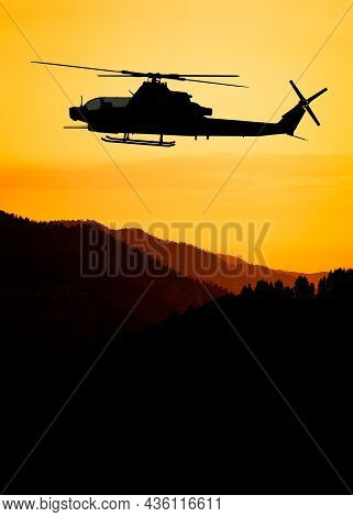 American Attack Helicopter Silhouette In The Flight