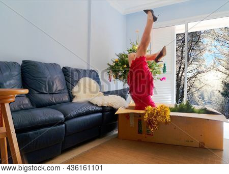 Women Decorating Chritmas Tree And Falling Upside Down