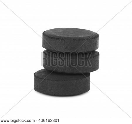 Activated Charcoal Pills On White Background. Potent Sorbent