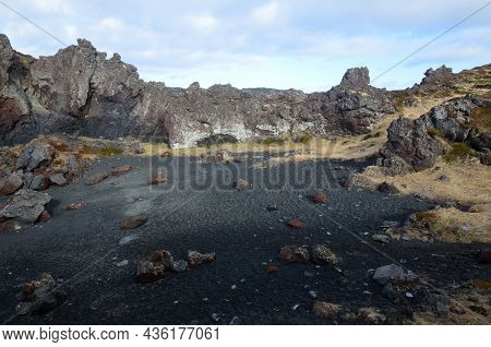 Black Lava Rock Formations On Dritvik Beach In Iceland.