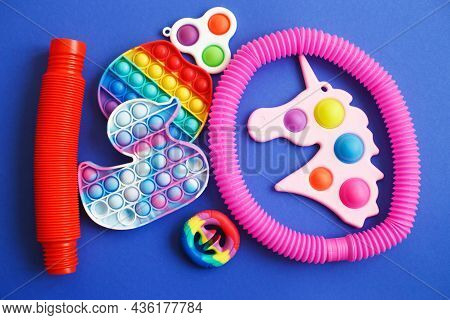 Colorful Antistress Sensory Fidget Toys On A Blue Background