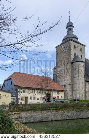 Bad Driburg, Germany - December 21, 2020: Heerse Moated Castle And Church St. Urbanus From The Middl
