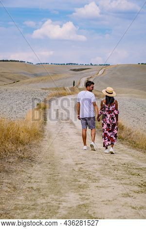 Couple Man And Woman On Vacation In Italy Toscane Watching The Golden Hills Of Toscane In Italy Euro