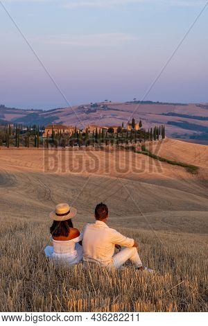 Couple Man And Woman On Vacation In Italy Toscane Watching The Golden Hills Of Toscane In Italy Euro