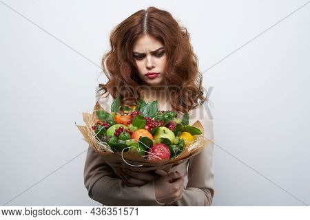 Cheerful Woman Bright Makeup Attractive Look A Bouquet Of Fruits Light Background