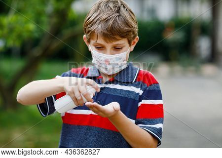 School Kid Boy With Medical Mask As Protection Against Pandemic Coronavirus Quarantine Disease. Chil