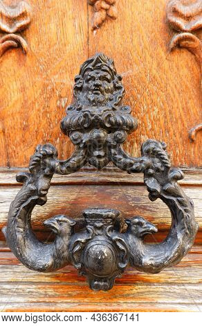 European Vintage Old Metal Wrought Iron Door Knocker. Design Detail. Paris.