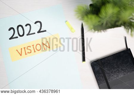 Top View Of Written 2022 Vision On Paper - Concpet Of New Strategy And Future Goal Setting Or Plannn