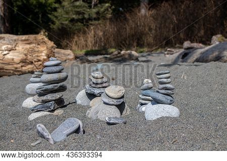 Stones Stacked In The Sand At Sombrio Beach, Port Renfrew, British Columbia, Canada
