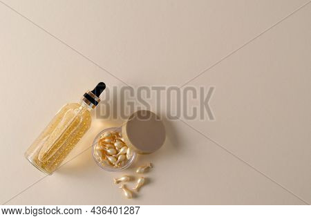 Rejuvenating Cream Facial Serum Capsules And Hyaluronic Serum In A Bottle On A Beige Background, Bac