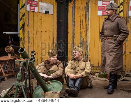 Wroclaw, Poland - September 19, 2021:
Three Soviet Soldiers Dressed In Military Uniforms, Surrounded