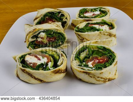 Spinach And Feta Pinwheel Sandwich On A Plate