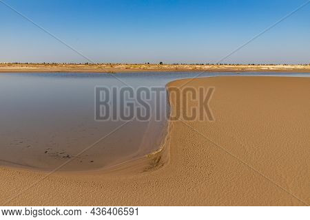 Lake, Sand, Dunes And Vegetation