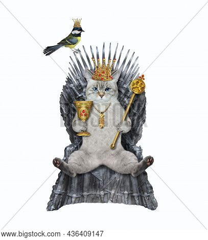 An Ashen Cat In A Crown Holds A Scepter And A Golden Goblet On A Metal Throne. White Background. Iso