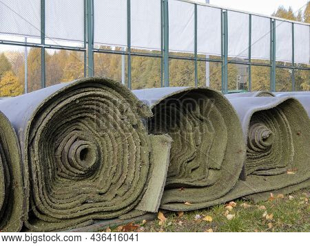 Rolled Up Used Artificial Turf When The Sport Season Ended. Expired Artificial Turf For Athletic Fie