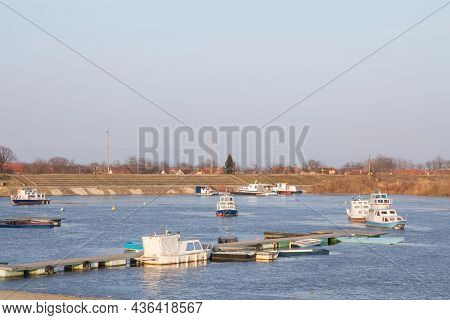 Panorama Of The Port Of Kovin, On The Danube, With Boats And Ship Anchored In Frozen Waters In Winte