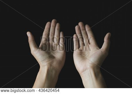 Praying Hands. Black Background. Make A Wish In God. Faith In Religion And Belief In God On The Powe