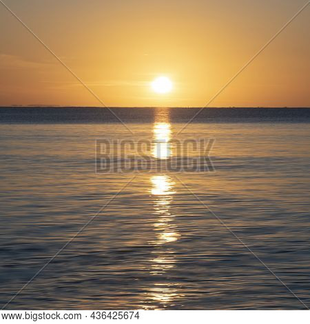 Beautiful Sunrise Over Pentewan Sands In Cornwall With Pastel Sky And Long Exposure Ocean