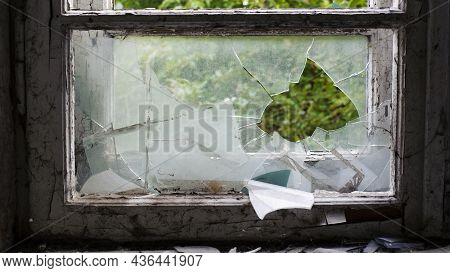 Smashed Glass Window With Old Wooden Frame. Old Window. Finely Broken Glass. Old House, Retro. Crack