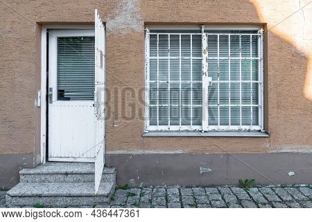 Barred Entrance Door And Window On A House