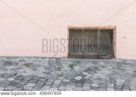 Old Rusty Cellar Window With Iron Grating