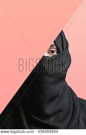 Young Muslim Women With Expressive Eyes Covering Part Of Her Face With Colored Paper. Muslim Girl In