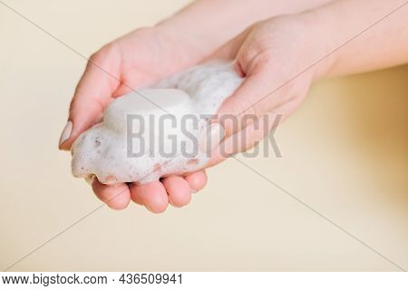 Solid Bar Of Shampoo In Woman's Hands With Foam. Alternative Type Of Shampoo. Eco Friendly Self Care