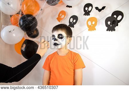 Happy Boy Preparing For Halloween. The Boy Gets A Skeleton Makeover For The Holiday