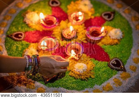 Traditional Diya Lamps Lit During Diwali Celebration