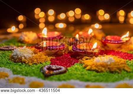 Traditional Diya Lamps Lit During Diwali Celebration