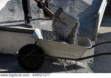 Delivery Of Gray River Pebbles, Gravel As Mulch For Flower Beds In The Garden Using A Wheel From The