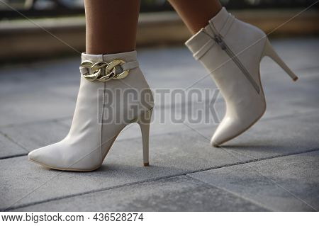Stylish White Leather Boots Outdoors In The Street